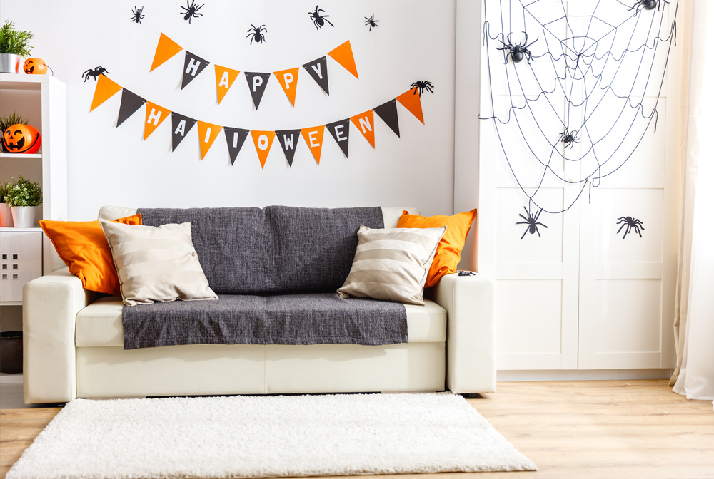 Cut triangles to make Halloween pennants. Colour them orange and black. Don’t forget the ‘Happy Halloween’ wishes!