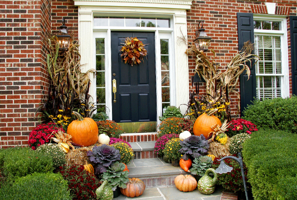 Pumpkins, gourds, dried foliage make for beautiful outdoor decor. Finish the look with a door wreath made of colourful fall leaves
