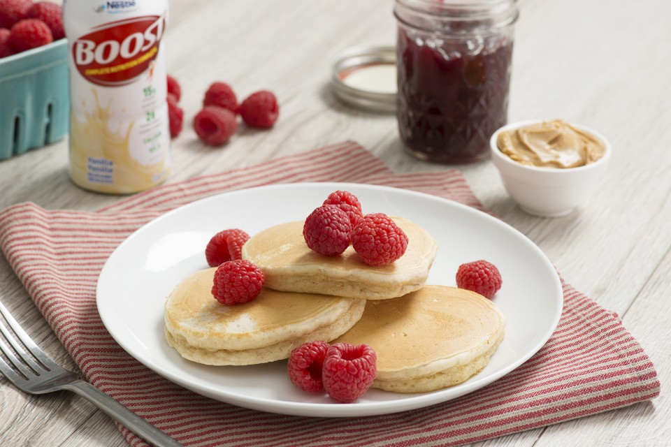 BOOST High Protein PB&J Pancakes Recipe. The classic duo of peanut butter and jam in fluffy buttermilk pancakes.