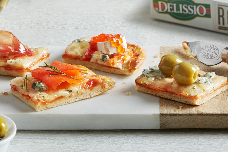 Quattro Formaggi Hors d'Oeuvres recipe. Impress your guests with these topped DELISSIO Rustico pizza pieces.